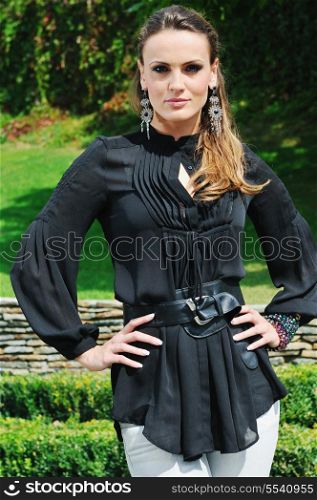 young woman posing in fashionable clothing outdoor