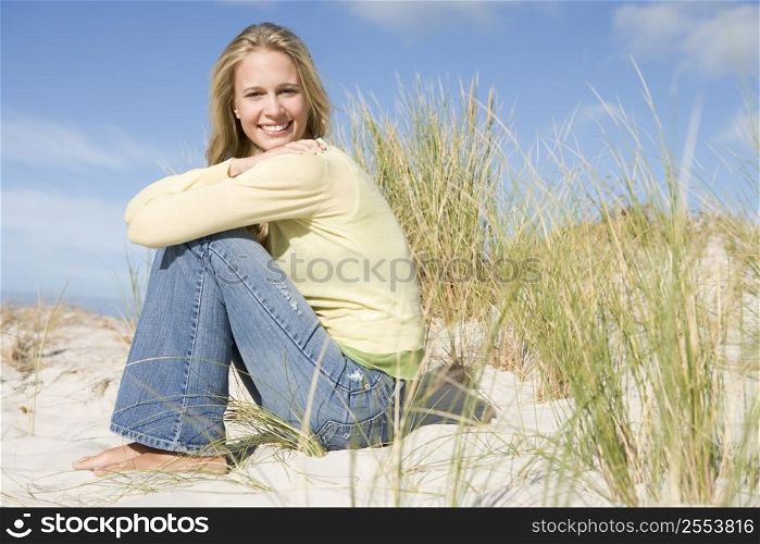 Young woman posing on a sand hill