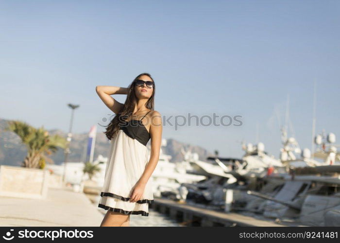 Young woman posing on the street in the summer