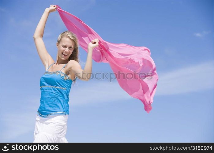 Young woman posing with a scarf