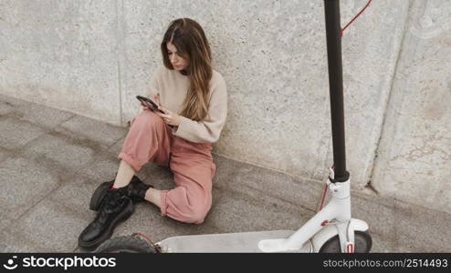 young woman posing with electric scooter 6