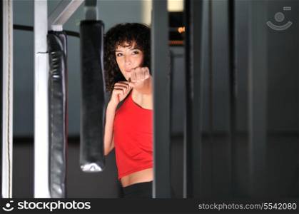 young woman practicing fitness and working out in a gym