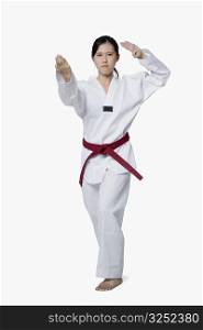 Young woman practicing karate