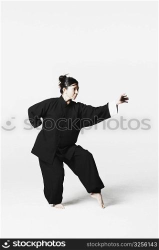 Young woman practicing martial arts