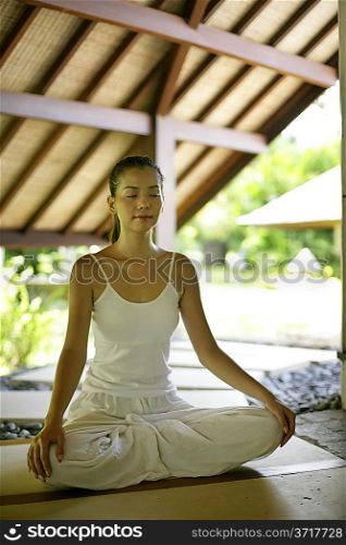 Young woman practising yoga