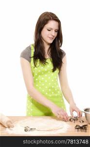 young woman preparing christmas molds. young smiling woman preparing christmas molds for baking with dough on white background