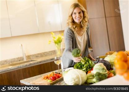 Young woman preparing food in modern kitchen