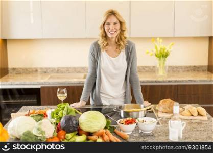 Young woman preparing food in modern kitchen