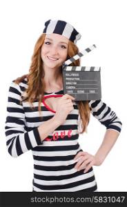 Young woman-prisoner with movie board isolated on white