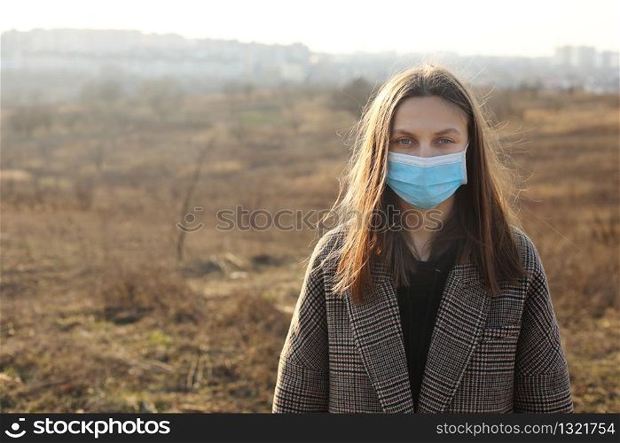 young Woman protecting from coronavirus outdoors. Covid-19. young Woman protecting from coronavirus outdoors. Covid-19.