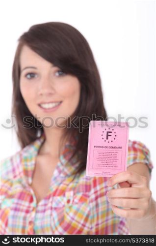 Young woman proud to show her driver&rsquo;s license