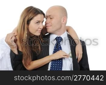 young woman pulls money out of pocket businessman. Isolated on white