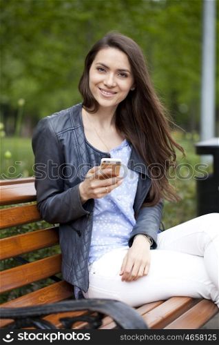 Young woman reading a message on the phone