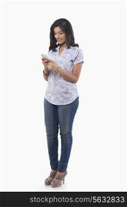Young woman reading an sms on mobile phone