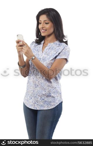Young woman reading an sms on mobile phone