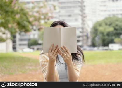 young woman reading interesting book
