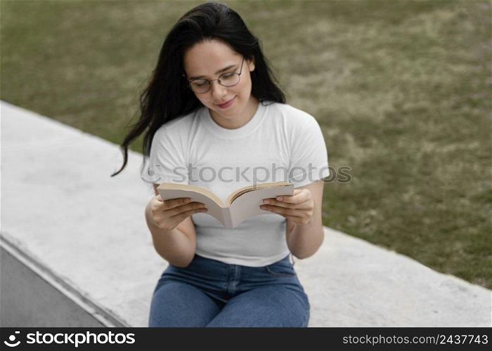young woman reading interesting book 3