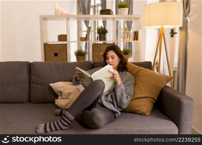 young woman reading living room