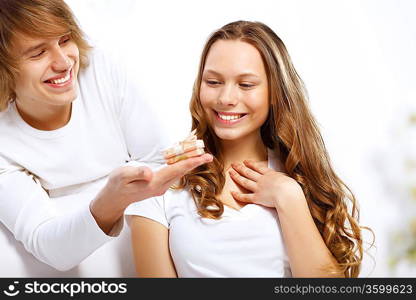 Young woman receiving a gift from her boyfriend