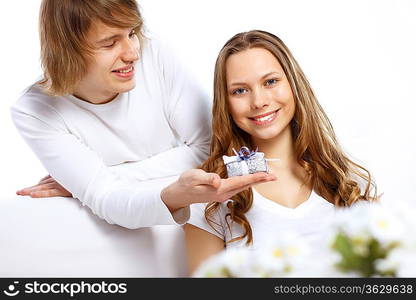 Young woman receiving a gift from her boyfriend