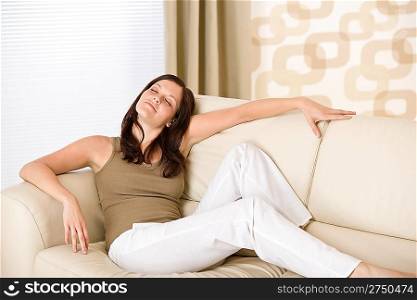 Young woman relax in lounge on sofa