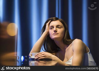 Young woman relaxing at bar