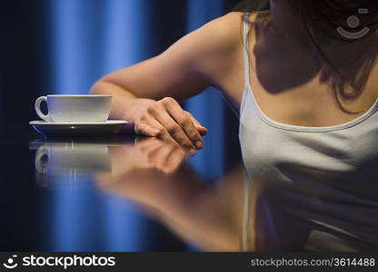 Young woman relaxing at bar