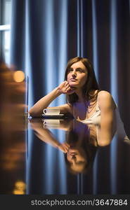 Young woman relaxing at bar