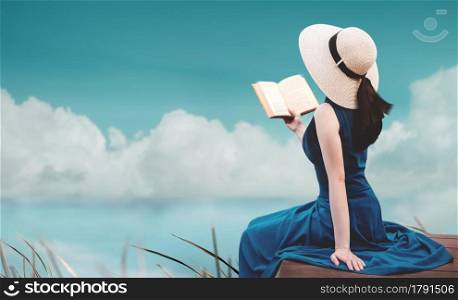 Young Woman Relaxing by Nature in Summer. Sitting on Deck and Reading Book. Harmony Living. Vintage Pastel Tone