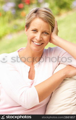 Young Woman Relaxing In Garden