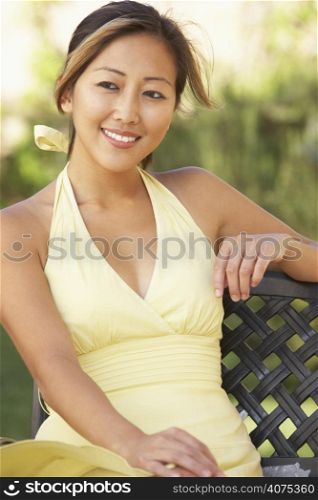 Young Woman Relaxing In Garden