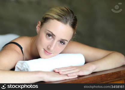 Young woman relaxing in massage table