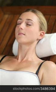 Young woman relaxing in massage table