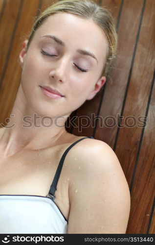 Young woman relaxing in massage table