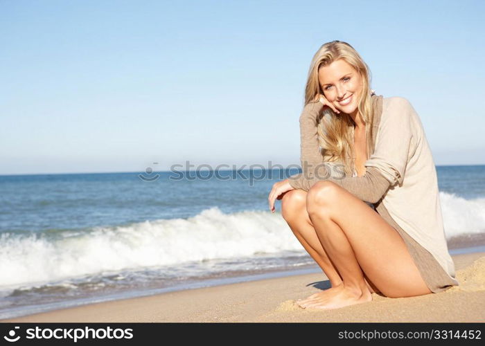 Young Woman Relaxing On Beach