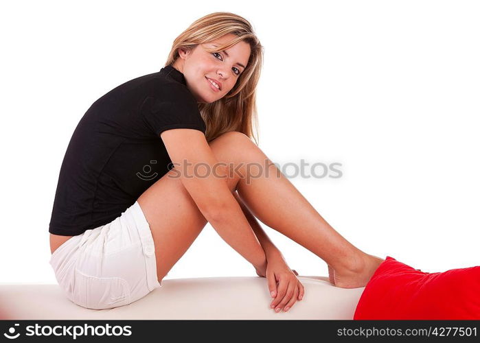 Young woman relaxing on couch - isolated