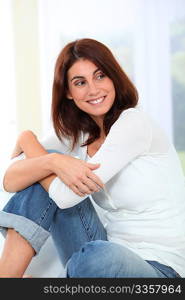 Young woman relaxing on sofa