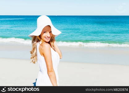 Young woman relaxing on the beach. Portrait of young pretty woman relaxing on sandy beach