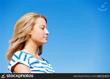 Young woman relaxing on the beach. Portrait of young pretty woman relaxing on sandy beach
