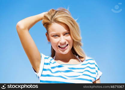 Young woman relaxing on the beach. Portrait of young pretty woman relaxing on sandy beach