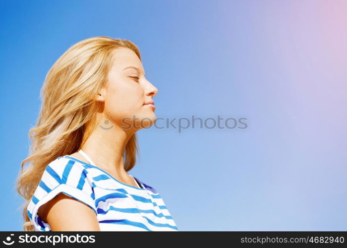 Young woman relaxing on the beach. Portrait of young pretty woman relaxing on sandy beach