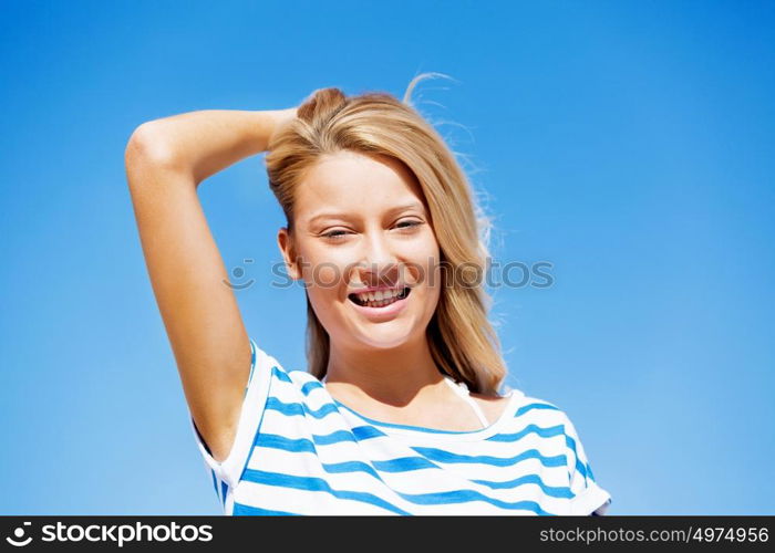 Young woman relaxing on the beach. Portrait of young pretty woman relaxing on sandy beach