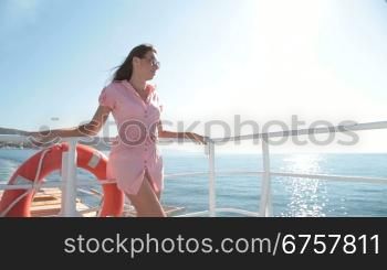 young woman relaxing on the deck of the sailing ship