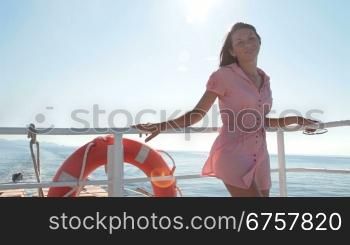 young woman relaxing on the deck of the sailing ship