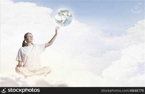 Young woman representing soul balance and meditation concept. Elements of this image are furnished by NASA. Recreation and relax