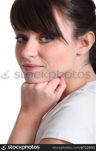 Young woman resting her hand on her chin