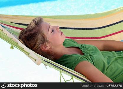 Young woman resting on a hammock