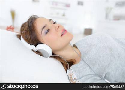 young woman resting while listening to the music