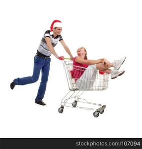 Young Woman Rides in a Shopping Basket, Led by a Young Man for Christmas Sale on White Background