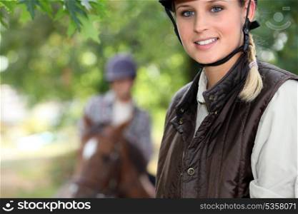 young woman riding a horse